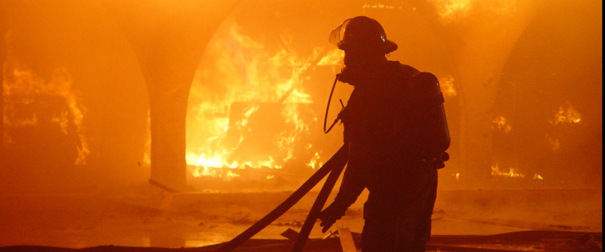 Fireman fighting a building fire.